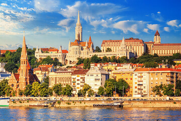 Naklejka premium City summer landscape - view of the Buda Castle, palace complex on Castle Hill with Matthias Church over the Danube river in Budapest, Hungary