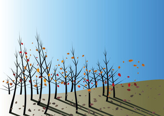Autumn leaves fall and are stirred by the wind on a clear blue day
