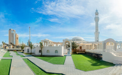 Alrahmah white mosque with city promenade in the background, Jeddah, Saudi Arabia