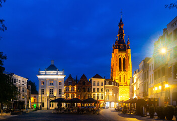 Fototapeta na wymiar Central Square of Belgian city of Kortrijk with Gothic Saint Martins church at summer evening