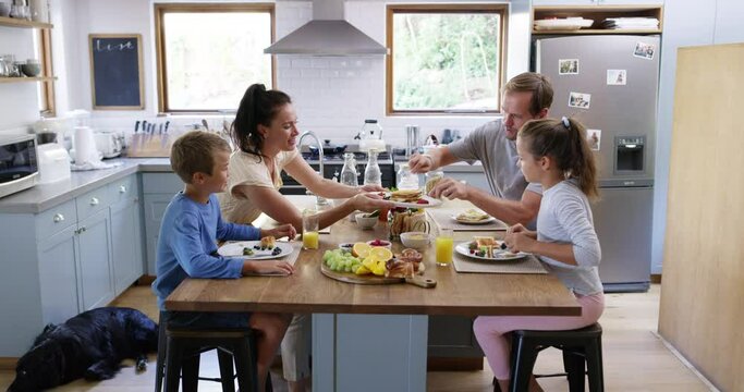 Family eating breakfast, healthy food and nutrition, relax in kitchen with happy people spending time together. Parents, children and bonding over morning meal with happiness, love and care at home
