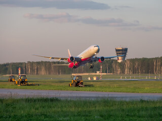 Takeoff of a Boeing 777-300 of ROSSIYA airlines from Vnukovo airport. Moscow region, Russia - July...