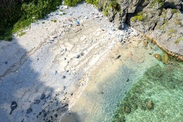 沖縄県国頭郡国頭村辺戸の辺戸岬、宇佐浜の海をドローンで空撮した風景 Aerial drone view of the sea at Cape Hendo and Usahama beach in Hendo, Kunigami-mura, Kunigami-gun, Okinawa, Japan 