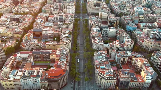 Aerial view of Barcelona city skyline, Passeig de Gracia and Eixample residential district at sunrise. Catalonia, Spain