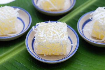 Steamed tapioca cake or cassava cake with grated coconut