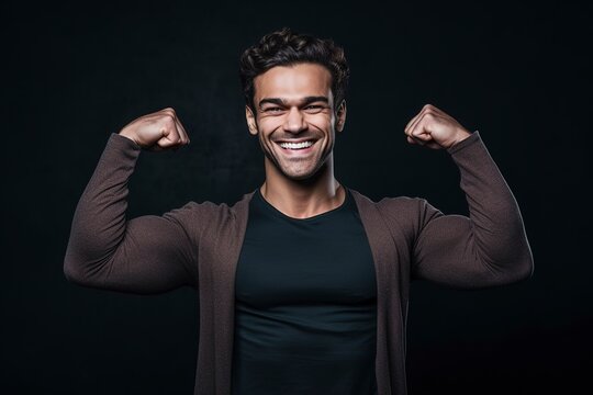 With a confident smile, the man flexes his impressive biceps, showcasing his strength and determination. Ai generated.
