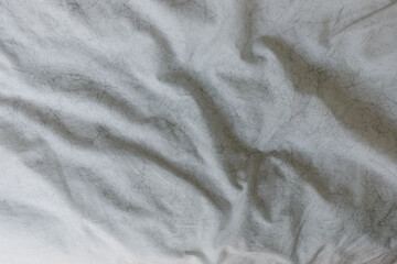 white sheets covered in black cat hair
