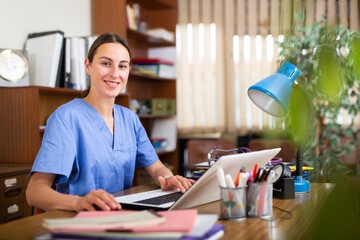 Doctor works in front of computers in a private clinic