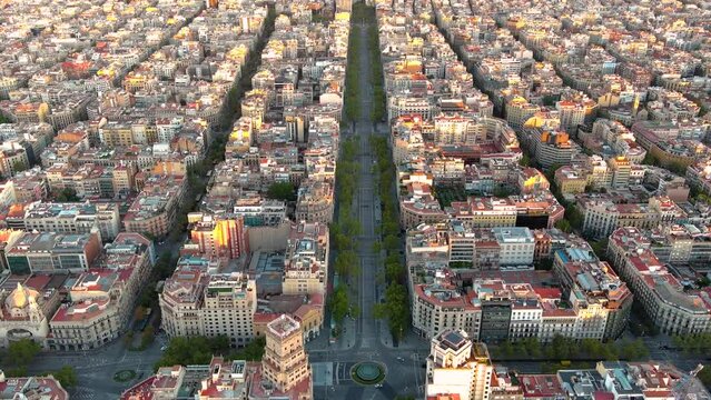 Aerial view of Barcelona city skyline, Passeig de Gracia and Eixample residential district at sunrise. Catalonia, Spain