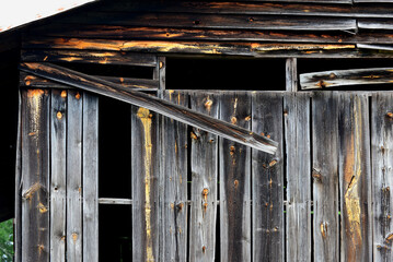 Fototapeta na wymiar Old warped boards on a barn
