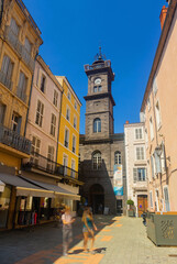 Fototapeta premium Exterior view of Clock Tower of Issoire during daytime. Puy-de-Dome department in Auvergne, central France.