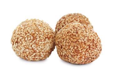 Many delicious sesame balls on white background