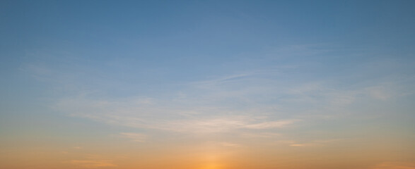 Fototapeta premium Morning sky scene with a bright golden light. Beautiful sunrise with clouds soft. Nature background concept