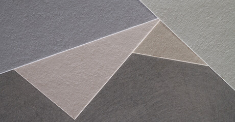Fototapeta premium gray and light gray colored paper with texture for postcard banner background.paper of different shades of gray for banner background.gray shades paper texture