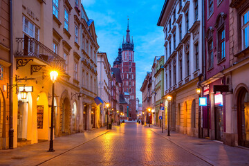 Night basilica of Saint Mary on Medieval Main market square in Old Town from Florianska street, Krakow, Poland