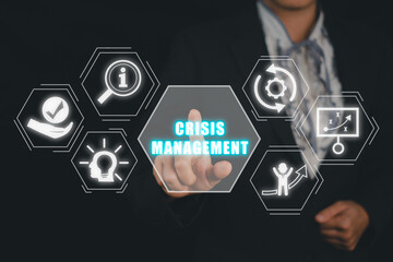 Crisis management concept, Business person hand touching crisis management icon on virtual screen.