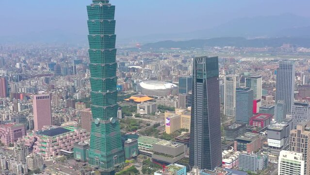 TAIWAN, TAIPEI - MAY, 2023: Aerial drone view of downtown city centre, with 101 Tower among crowded buildings in Xinyi District, Taipei