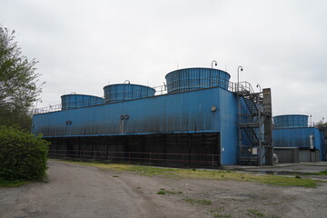 Almaty, Kazakhstan - 04.17.2023 : Cooling towers with water at the old heating plant.