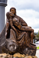 Wooden replica of the statue La Pietá located in the square next to the Cadetral de Pedra in Canela-RS, Brazil.