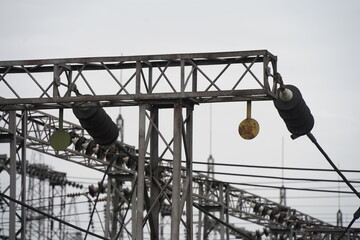 Almaty, Kazakhstan - 04.17.2023 : Power lines with inductors and stabilizers at the heating plant.