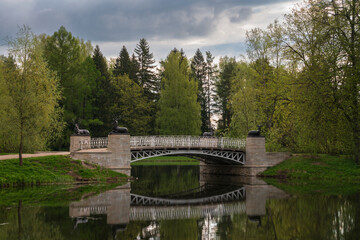 Obraz premium View of the Oleniy (Deer) Bridge in the Pavlovsk Palace and Park complex on a spring day, Pavlovsk, Saint Petersburg, Russia