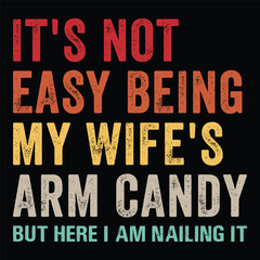 It's Not Easy Being My Wife's Arm Candy but Here I Am Nailing It t-shirt design.
