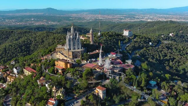 Fantastic overview aerial footage around the Expiatory Church of the Sacred Heart of Jesus (Temple Expiatori del Sagrat Cor) in Tibidabo mountain in Barcelona, Catalonia, Spain