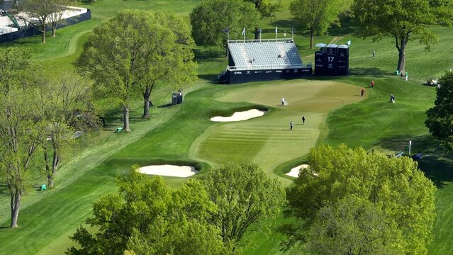 PGA Championship 2023 Golf course with greens and fairways at Oak Hill Country Club Pittsford, NY during morning course prep by staff and media