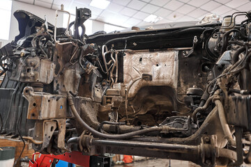 Car engine repair auto repair shop garage mechanic. car repair station. cars stand in small service and repair one car.