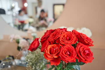 Florist at work. Summer bouquet of roses. Learning flower arranging, making beautiful bouquets with your own hands. Flowers delivery