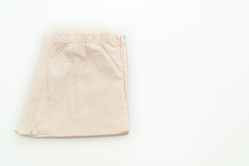 beige pant fold on white background