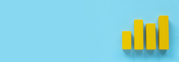 Business charts. Company financial report. Goal for business, bank, finance, investment, money. Quarterly report concept.  Yellow bar chart. Blue banner with copy space.	