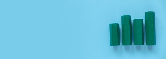 Business charts. Company financial report. Goal for business, bank, finance, investment, money. Quarterly report concept.  Green bar chart. Blue banner with copy space.	