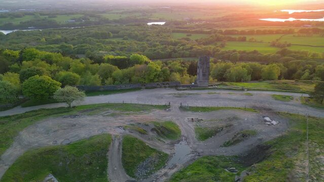Slow orbit of 19th centure tower building with sunset glow at the Pigeon Tower, Rivington, Lancashire, UK