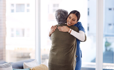 Hug, nurse and senior woman with a smile, service and healthcare with cure, happiness and help. Female person, medical professional or employee with a patient, embrace and care with support and happy
