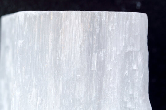 Selenite stone. Healing selenite chunk, morphological variation of natural gypsum, close up, macro