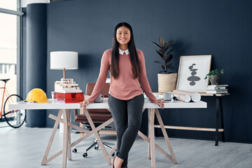 Portrait, architect and asian woman in office with engineering plan, blueprint and construction...