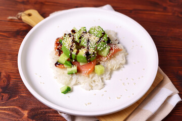 Sushi waffles are crispy rice cooked in a waffle iron with salmon. Trending food, hybrid food