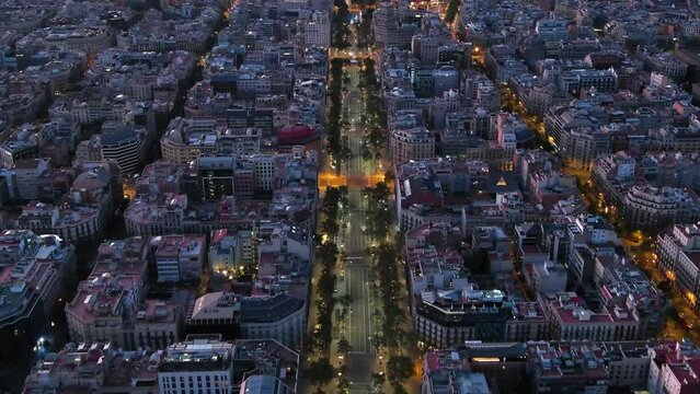 Aerial view of Passeig de Gracia, one of the major avenues in Barcelona at dusk time. Catalonia, Spain