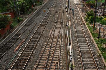 Fototapeta premium A man walking on railway track. Concept of railway accidents.