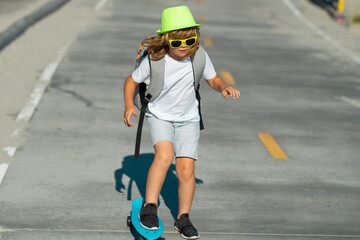 Kid with skateboard. Child hold skate board. Healthy sport and activity for school kids in summer. Sports fun.