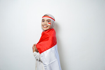 Portrait of Young Asian Muslim Women celebrate Indonesian independence day holding red and white flag