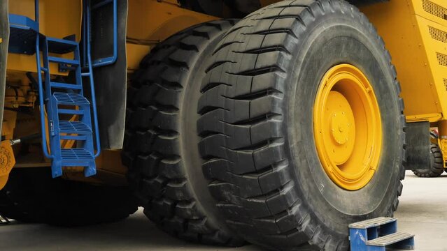 Wheel of the world's largest dump truck. Biggest car wheel. Cargo tyre