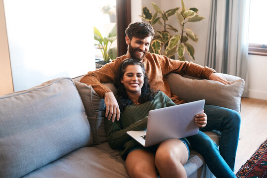 Relax, love and laptop with couple on sofa for happy, social media and streaming. Smile, internet and subscription with man and woman online in living room at home for network, news and website