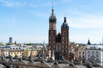 Naklejka na ściany i meble St. Mary's Basilica in Krakow, Poland. Aerial view of Main Market Square in the Old Town district of Cracow. Bazylika Mariacka or Kościół Mariacki Church Kraków.