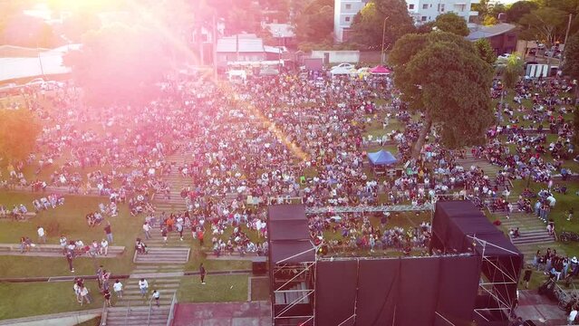 Aerial view of Posadas Anfiteatro El Brete festival in Argentina with visitors in city park, trees, and concert stage