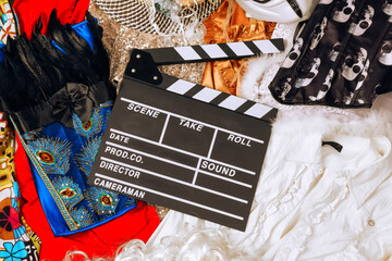 clapperboard on the background of different clothes
