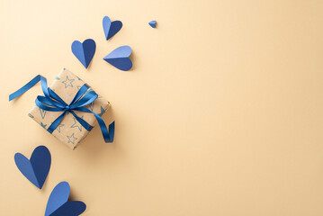Celebrate Father's Day in style with a beige-themed top view of flying hearts, and a craft paper gift box with ribbon bow featuring an empty space for text or ads