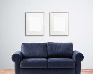 Frame mockup with a blue sofa and a white wall, wall art mockup
