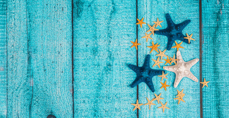 Marine items on blue wooden background. Sea objects on wooden planks. Copy space.